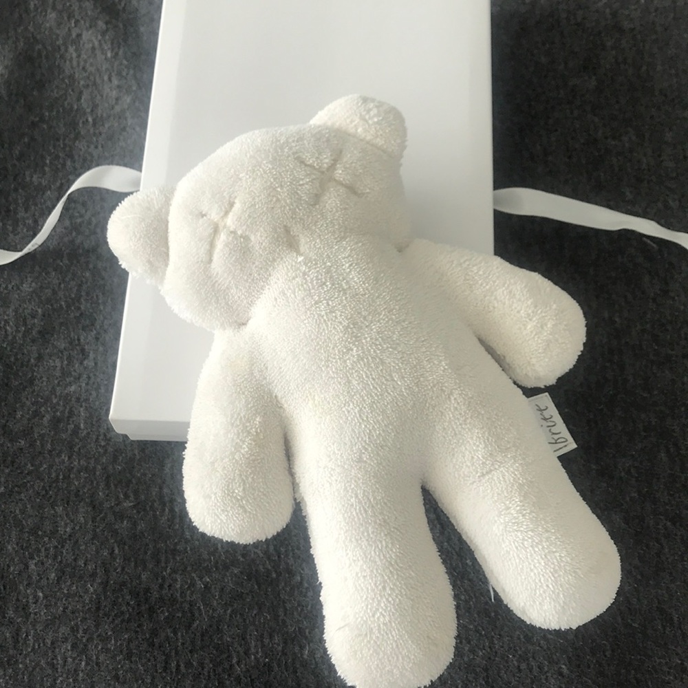 Britt snuggles Teddy Bear white